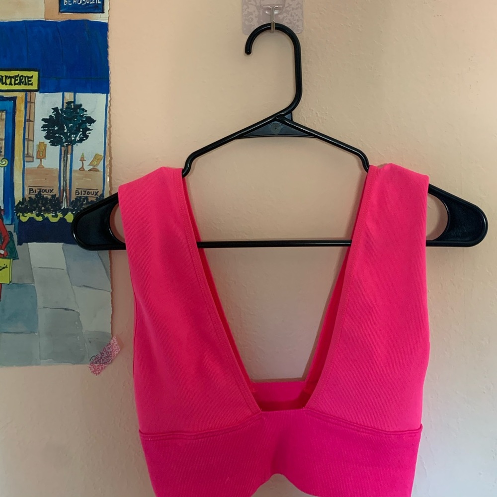 Out from under hot pink top